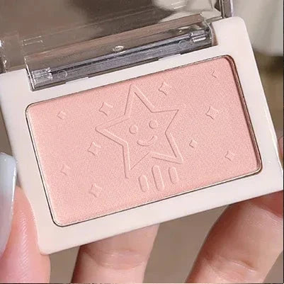Makeup product with a star logo on a neutral background